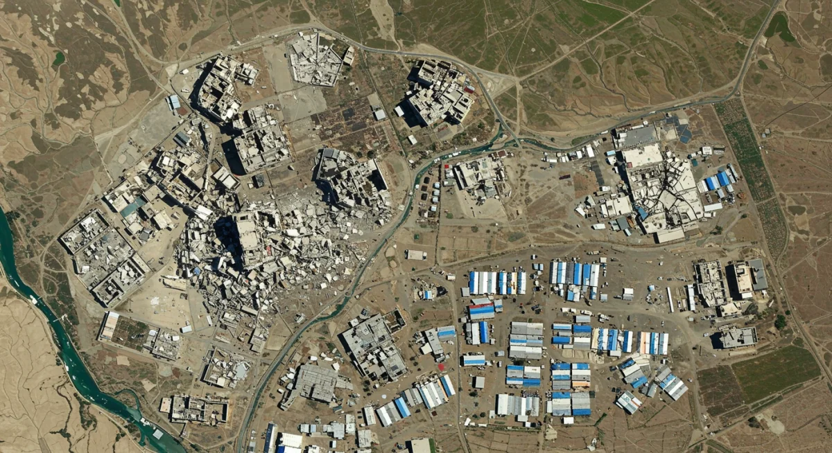 Satellite view of conflict zone damage and refugee camp infrastructure